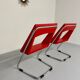 2 chaises tubulaire en simili rouge, années 80 en simili rouge