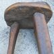 three-legged milking stool made of olive tree folk art