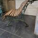 Old cast iron garden bench with oak slats