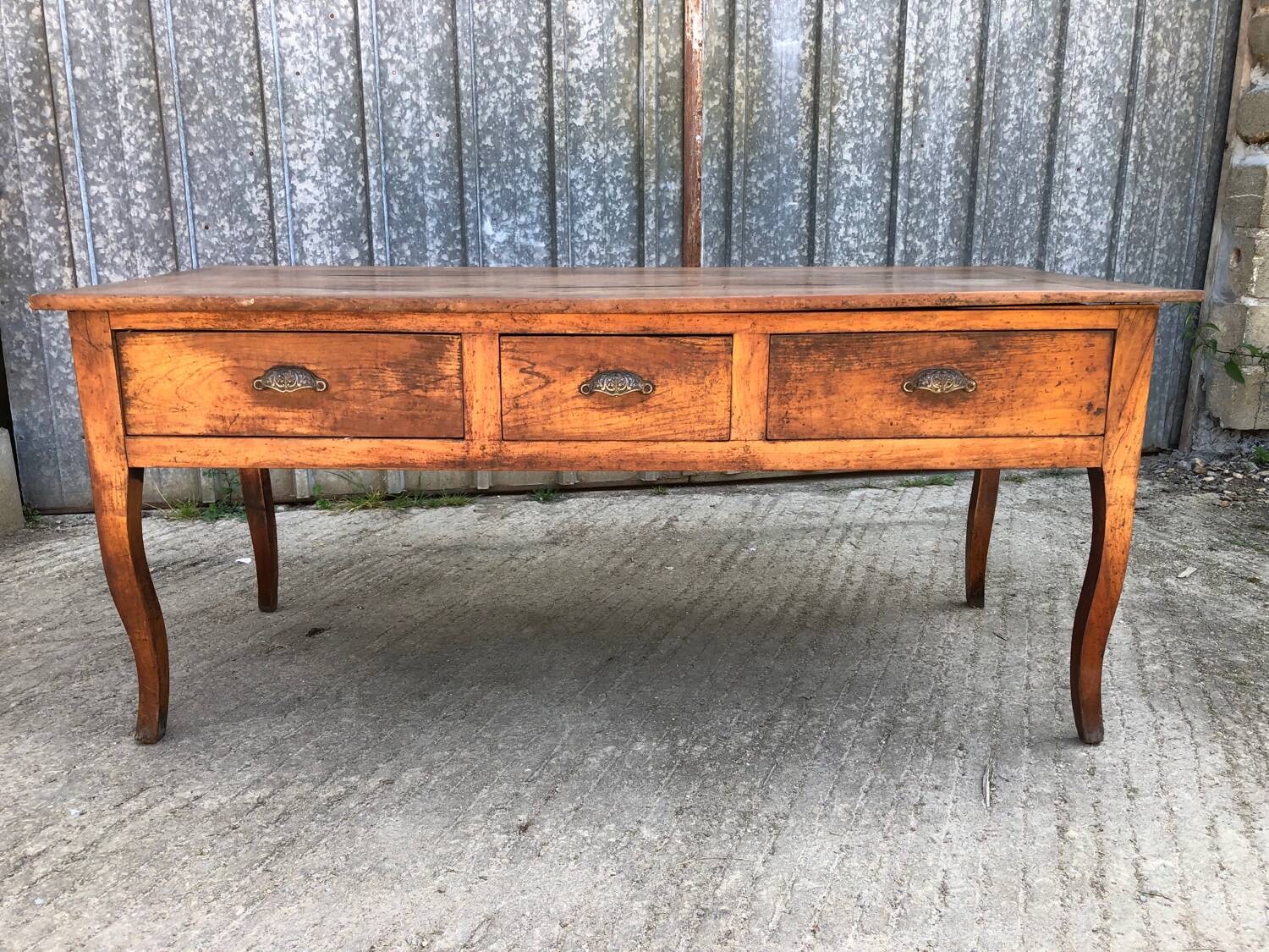 Antique solid cherry farmhouse table with 3 drawers and 2 pulls