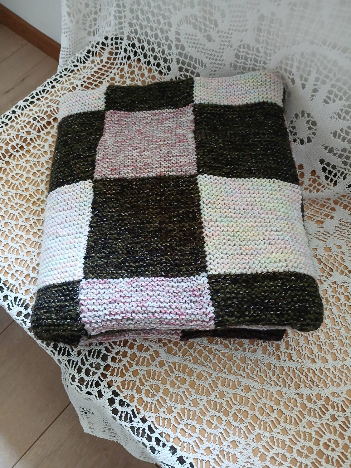 Hand-knitted patchwork plaid
