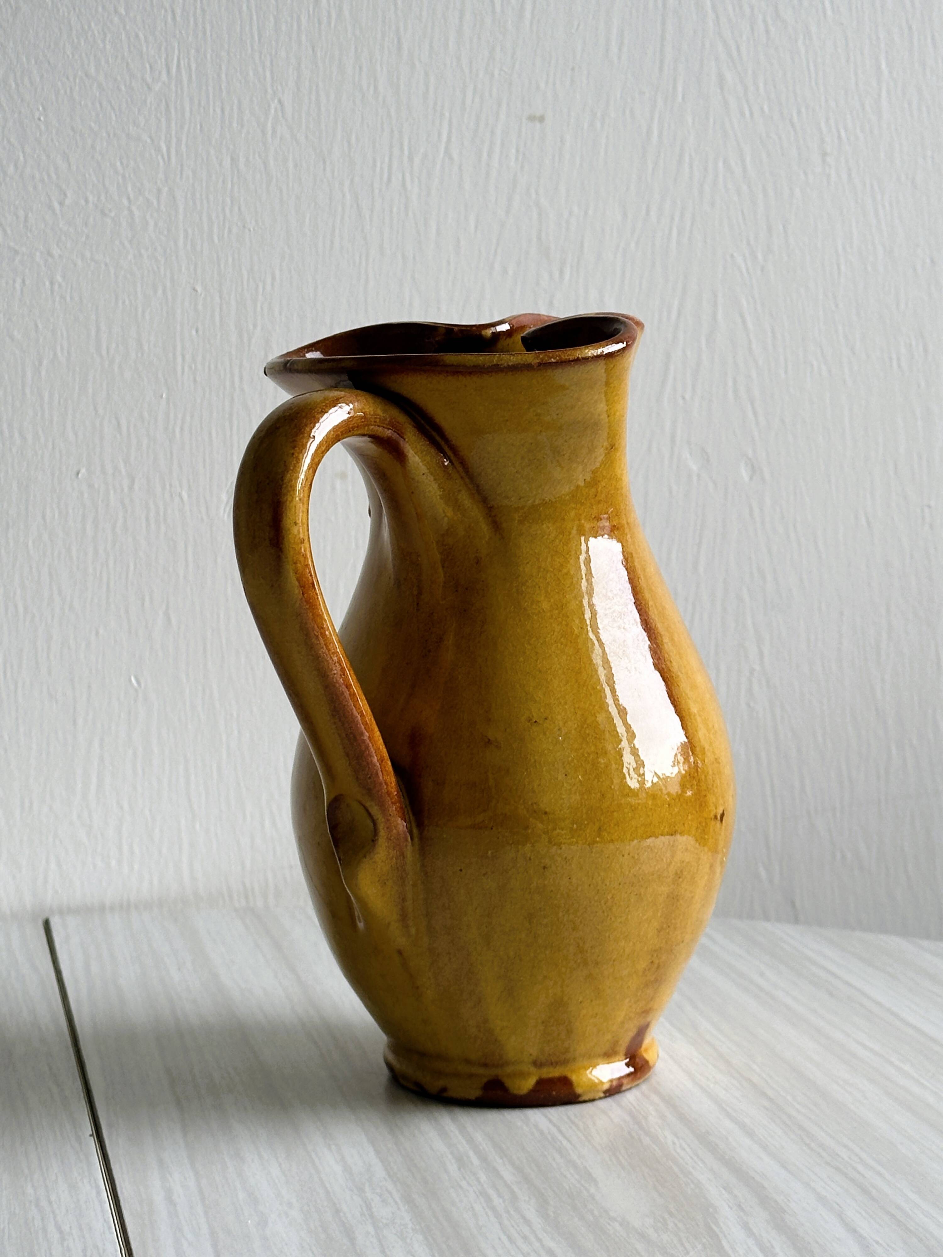 Vintage enameled ceramic pitcher - Retro mustard yellow jar.