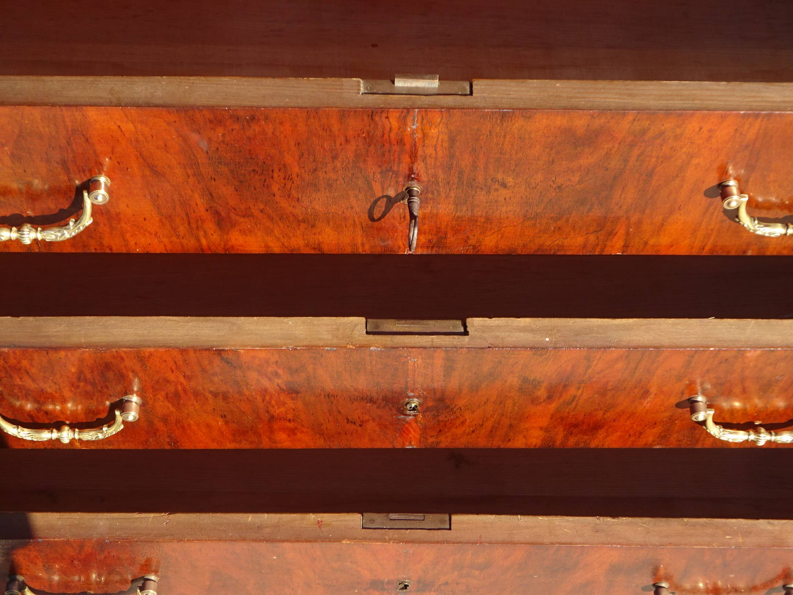 Antique mahogany chest of drawers with white marble.