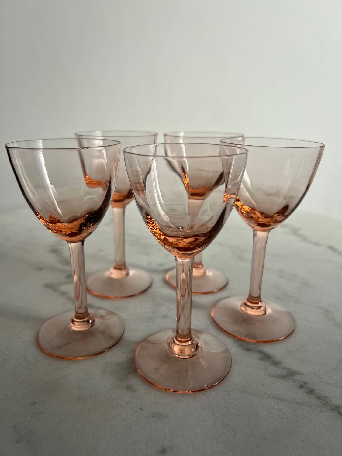 5 small pink glass stemmed glasses