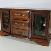 Wooden jewelry box in the shape of a dresser