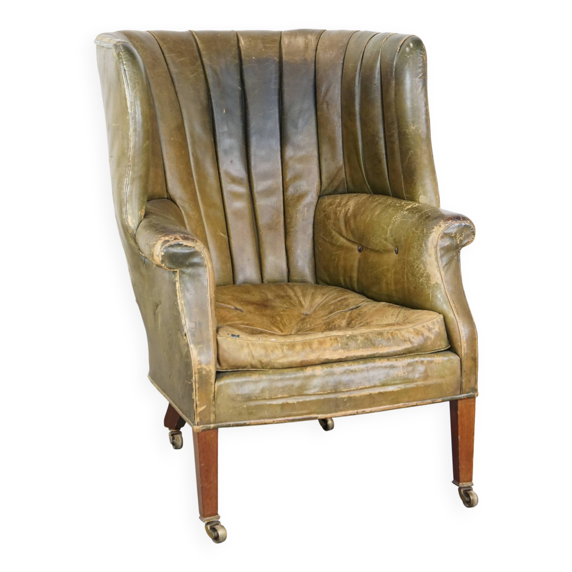 Green antique barrel back wingback chair on wheels