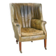 Green antique barrel back wingback chair on wheels