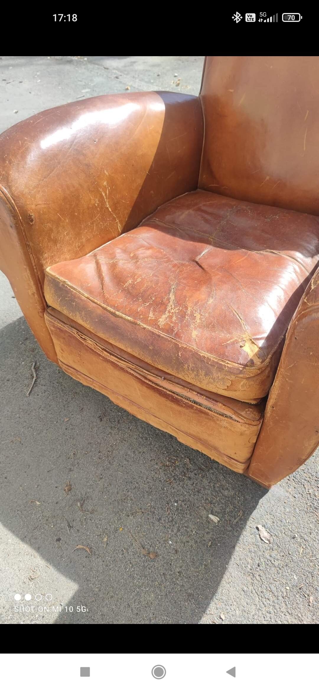 Pair of club chairs with moustache-shaped handles in Havana leather, in their original condition, circa 1930