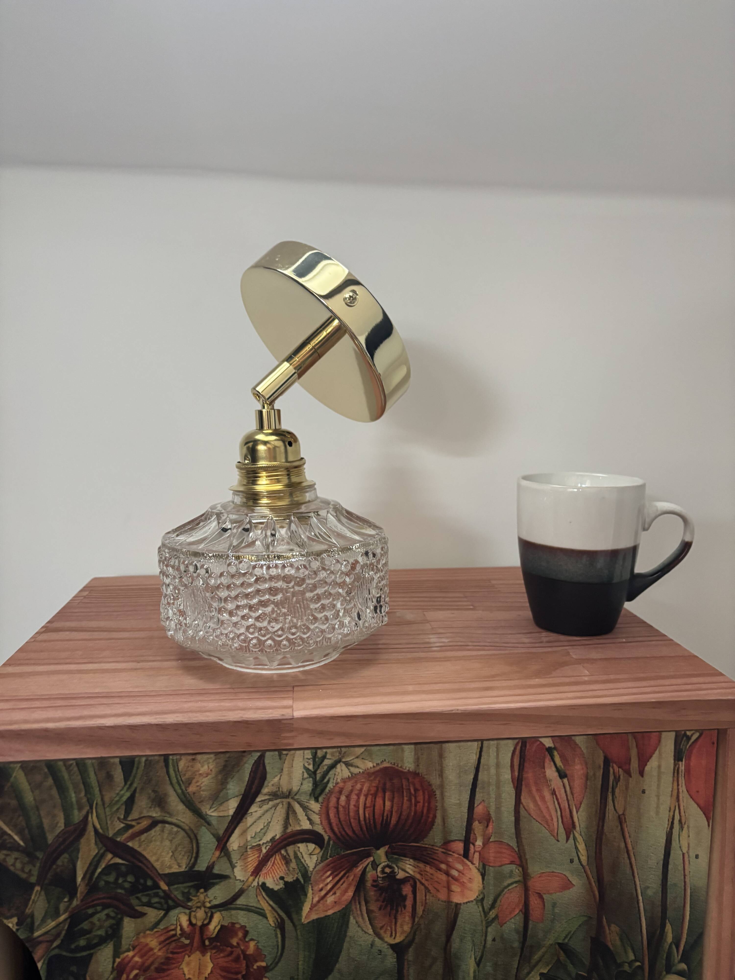 Gold tilting wall light