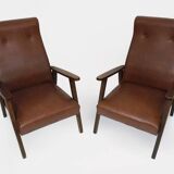 Pair of Scandinavian armchairs in brown leatherette and wood from the 50s and 60s