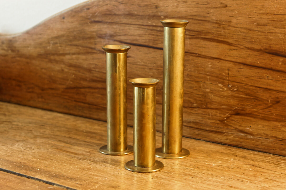 Trio of brass candle holders