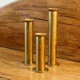 Trio of brass candle holders