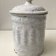 Vintage coffee pot in white enamelled iron and blue retro kitchen decoration