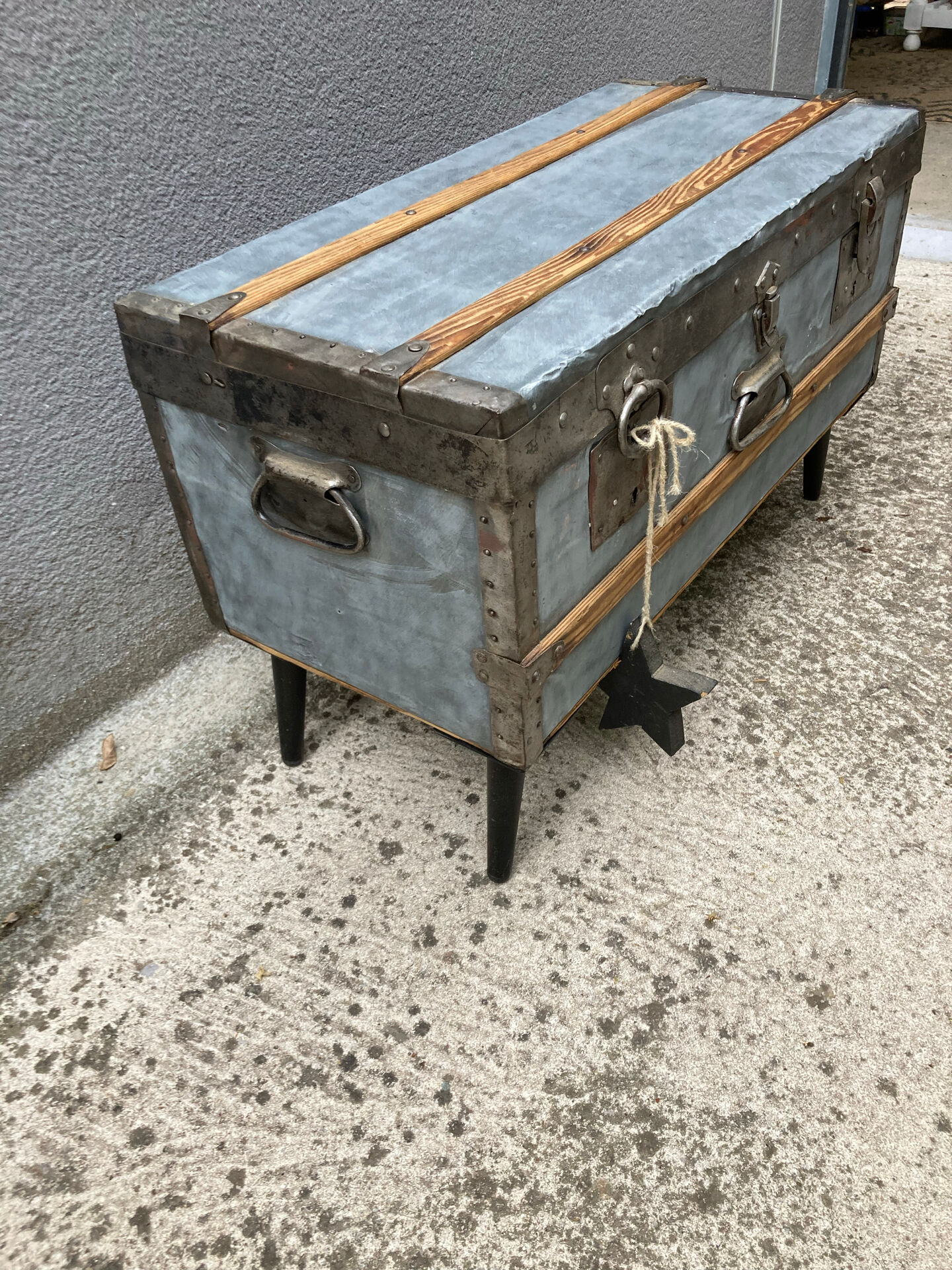 Old zinc trunk with legs, industrial console