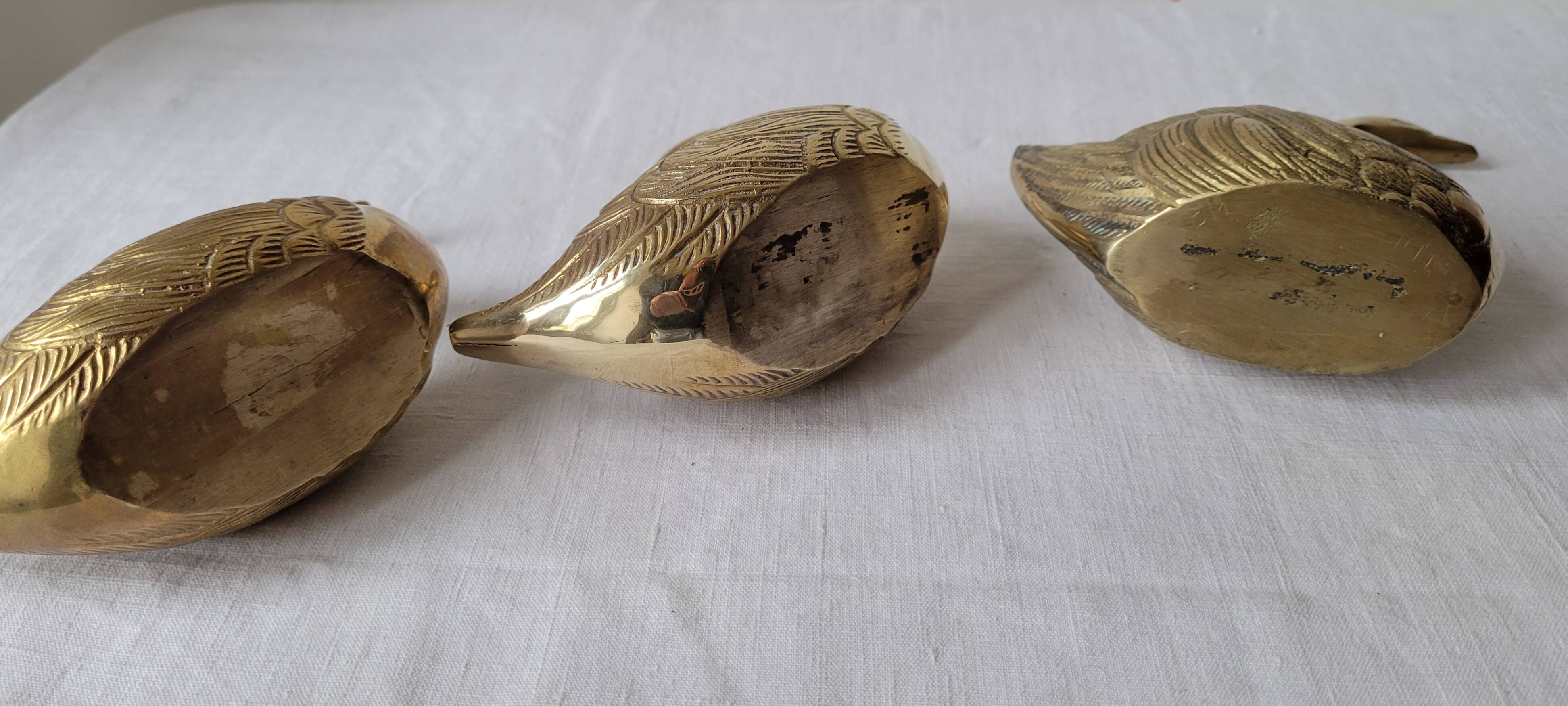 Trio of zoomorphic brass swan empty pockets