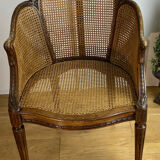 Old armchair with double cannage in walnut carved style Louis XVI of the nineteenth century