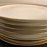 7 flat plates in porcelain of Limoges Bernardaud, decoration of golden Greek, XXth century