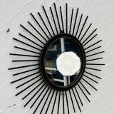 Vintage black and gold metal sun mirror from the 1960s.