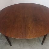 Scandinavian extendable round dining table in teak