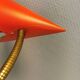 Danish red lacquered wall light with brass details. Estimated 1980s
