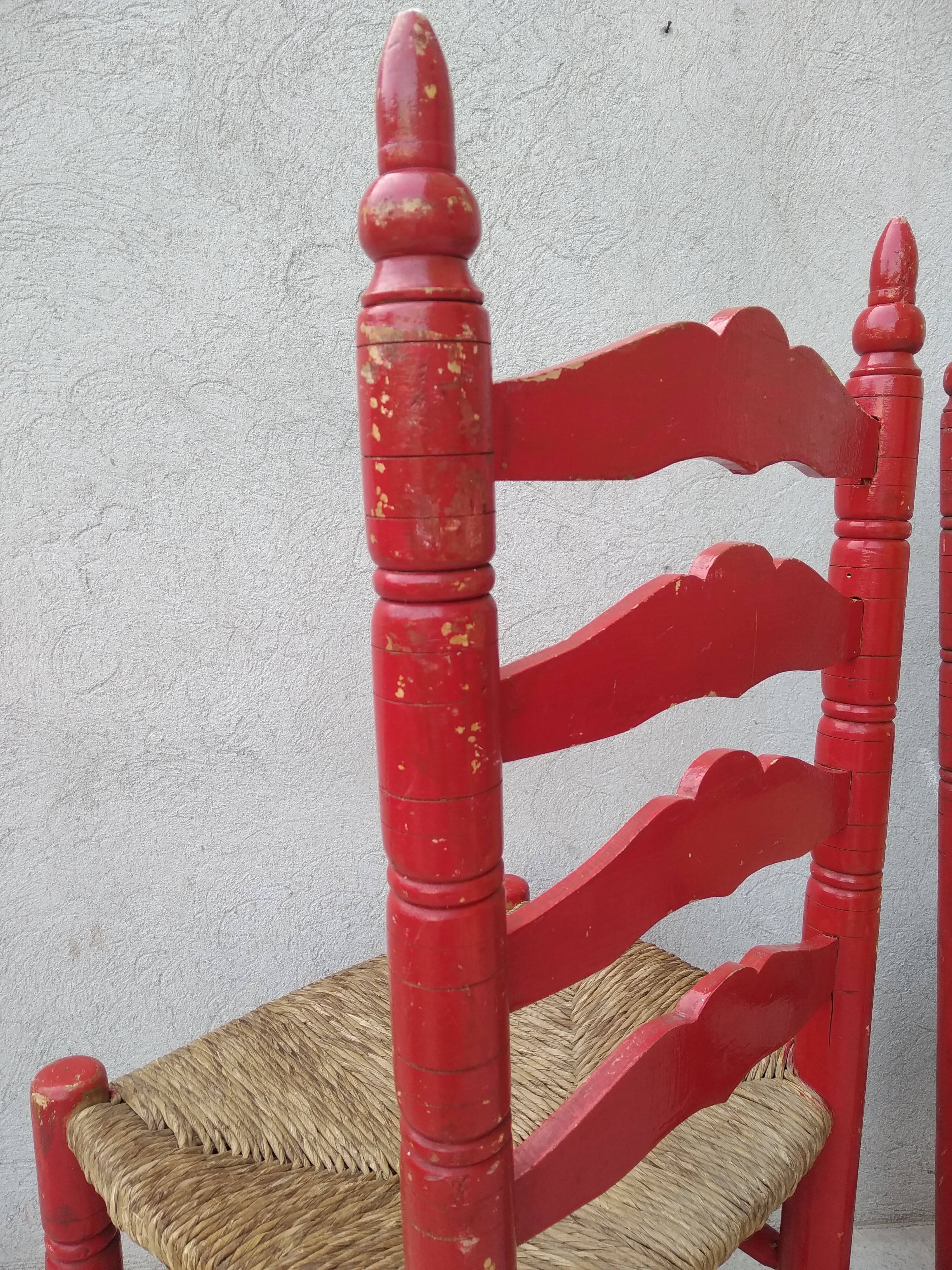 2 vintage red straw chairs