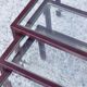 Nesting tables in burgundy lacquered metal and brass, France 1950s
