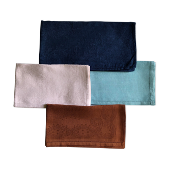 Suite of four tinted antique napkins