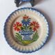 Pair of antique plates in popular earthenware with a floral basket decoration on the edge.