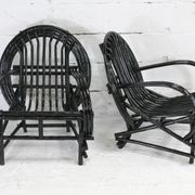 Pair of black lacquered rattan armchairs. France, cira 1960.