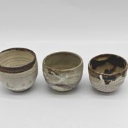 Trilogy of cups or Japanese-style goblets by the Danish ceramist Gutte Eriksen using RAKU technique.