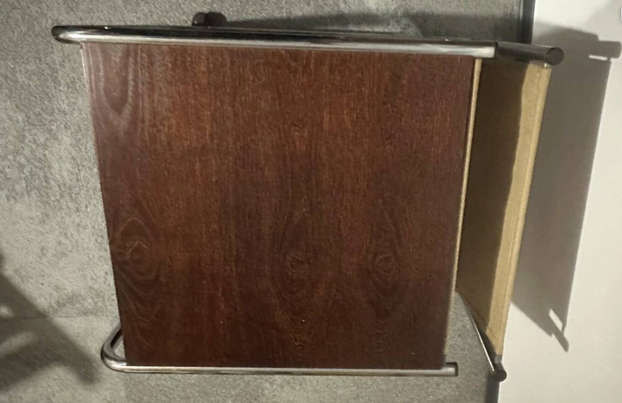 1970s/80s coffee table on casters with metal tubing, light-colored door