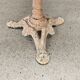 Bistro table with cast iron base and solid teak top