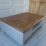 Coffee table on casters, made from an old desk, pearl gray base and belt.