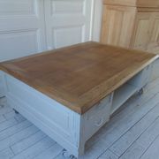 Coffee table on casters, made from an old desk, pearl gray base and belt.