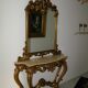 Mirror ensemble with golden wood console in baroque style with marble top.