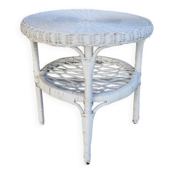 Round white rattan side table with storage underneath, circa 1970.