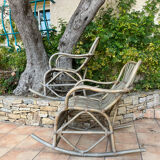 Pair of rocking-chairs in rattan 70s