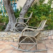 Pair of rocking-chairs in rattan 70s