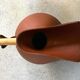 Studio pottery jug floor vase in terracotta and bamboo handle Germany 1950s