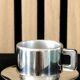 Set of 2 stainless steel espresso cups by Casalinghi.