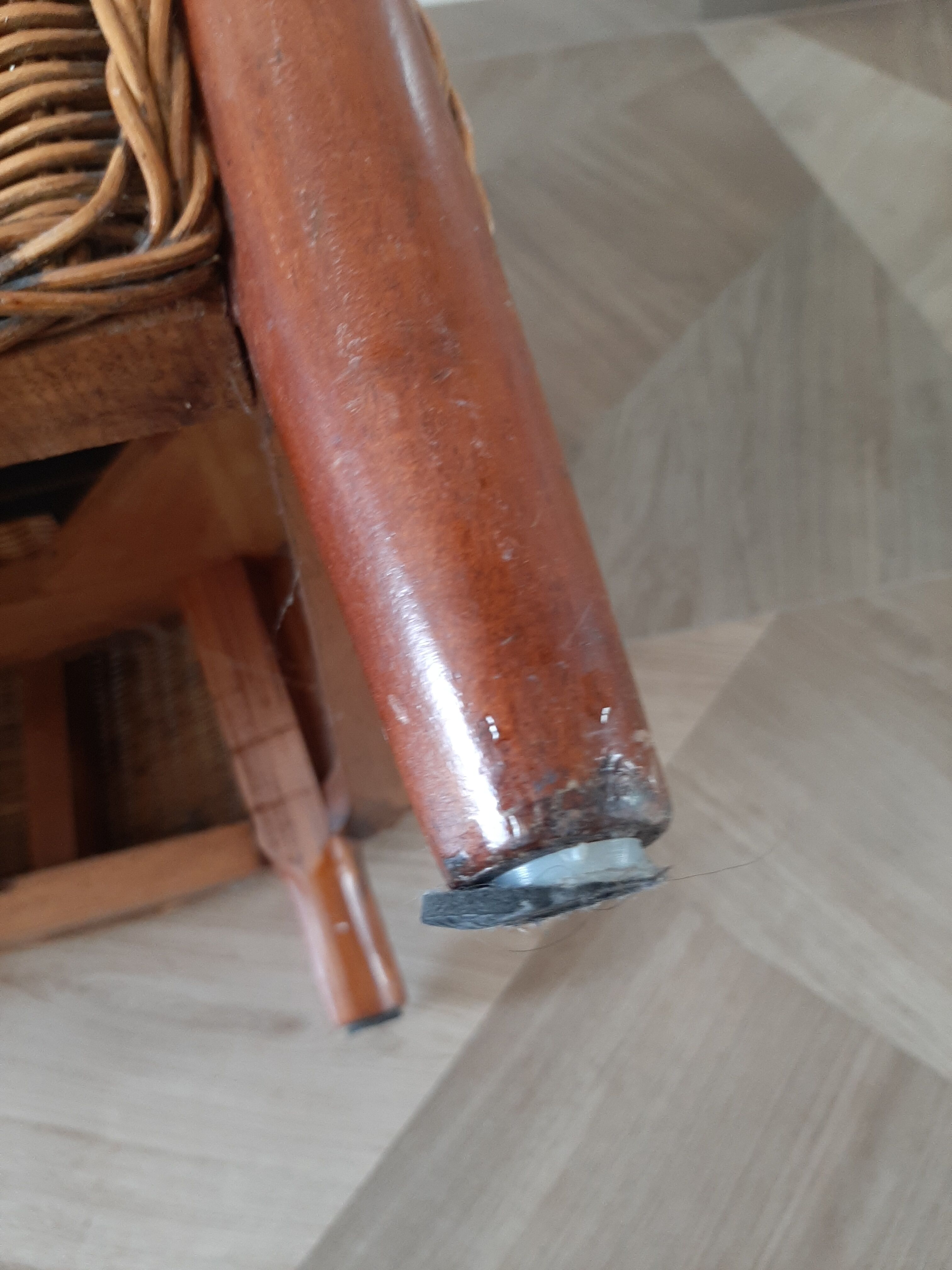 Armchair in woven rattan and exotic wood