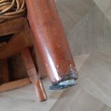 Armchair in woven rattan and exotic wood