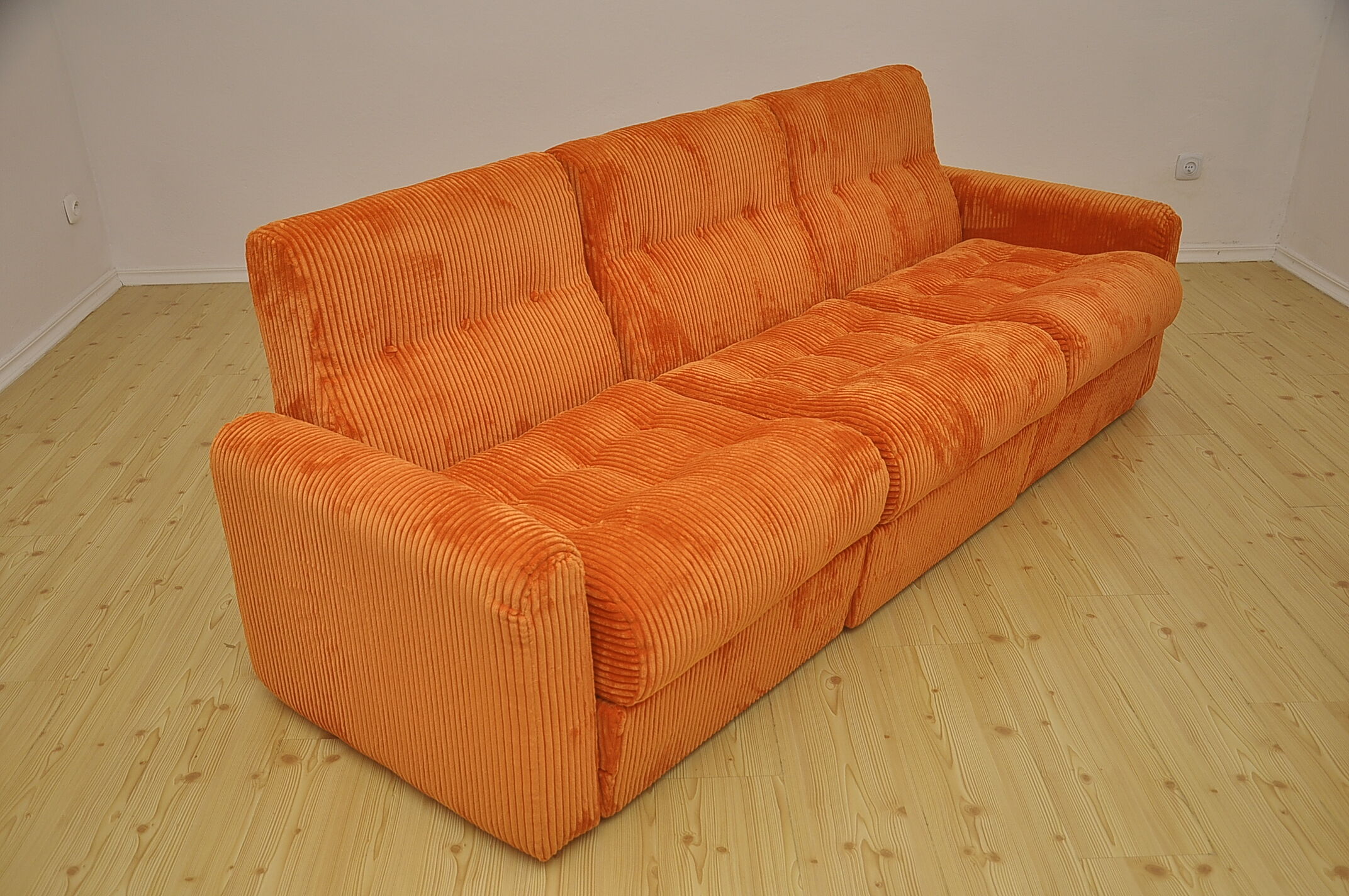 Orange corduroy modular sofa, 1970s.