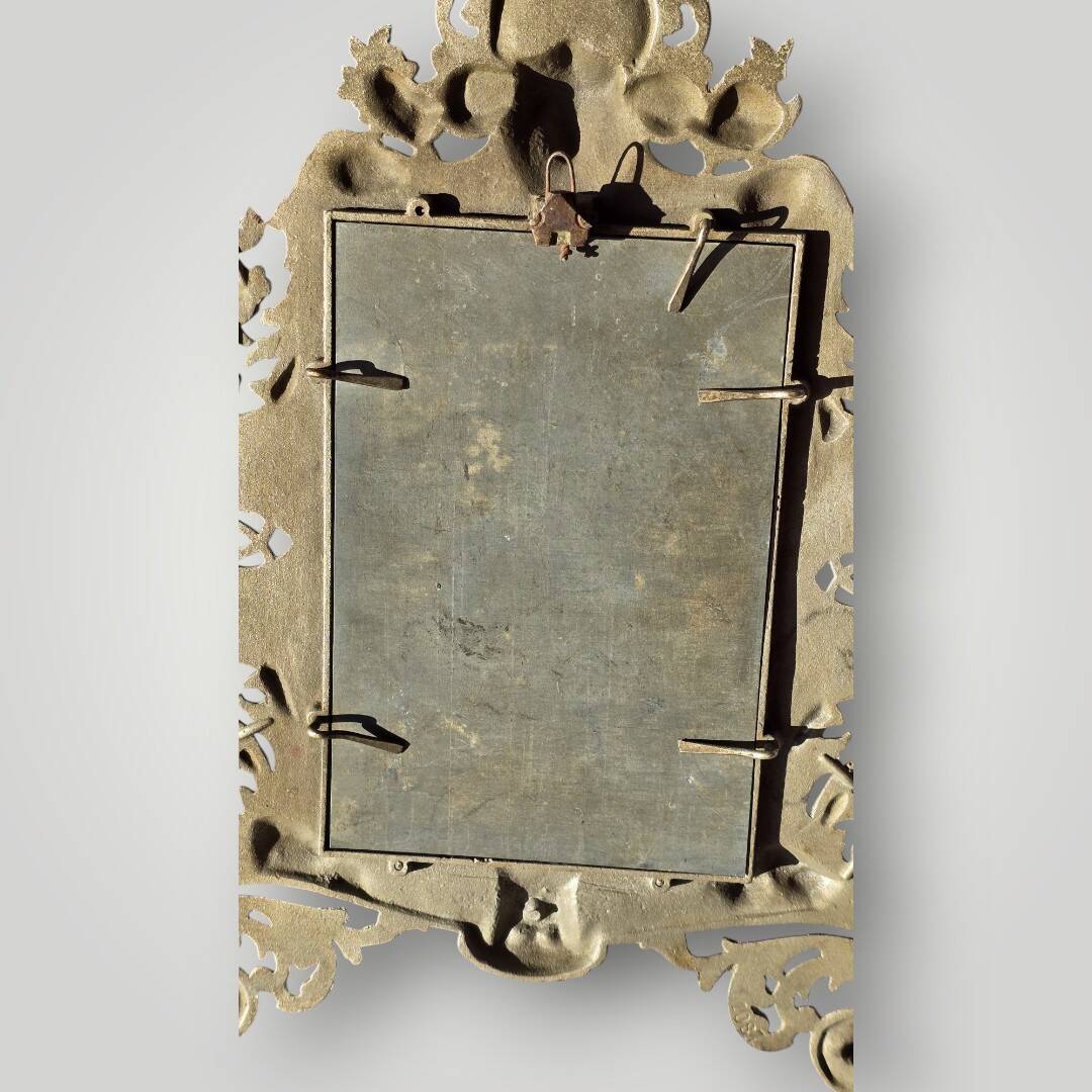 Gilded bronze wall mirror, beveled glass