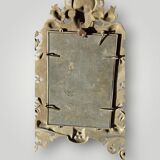 Gilded bronze wall mirror, beveled glass
