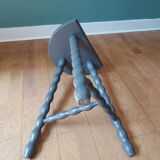 Bluish-grey tripod stool