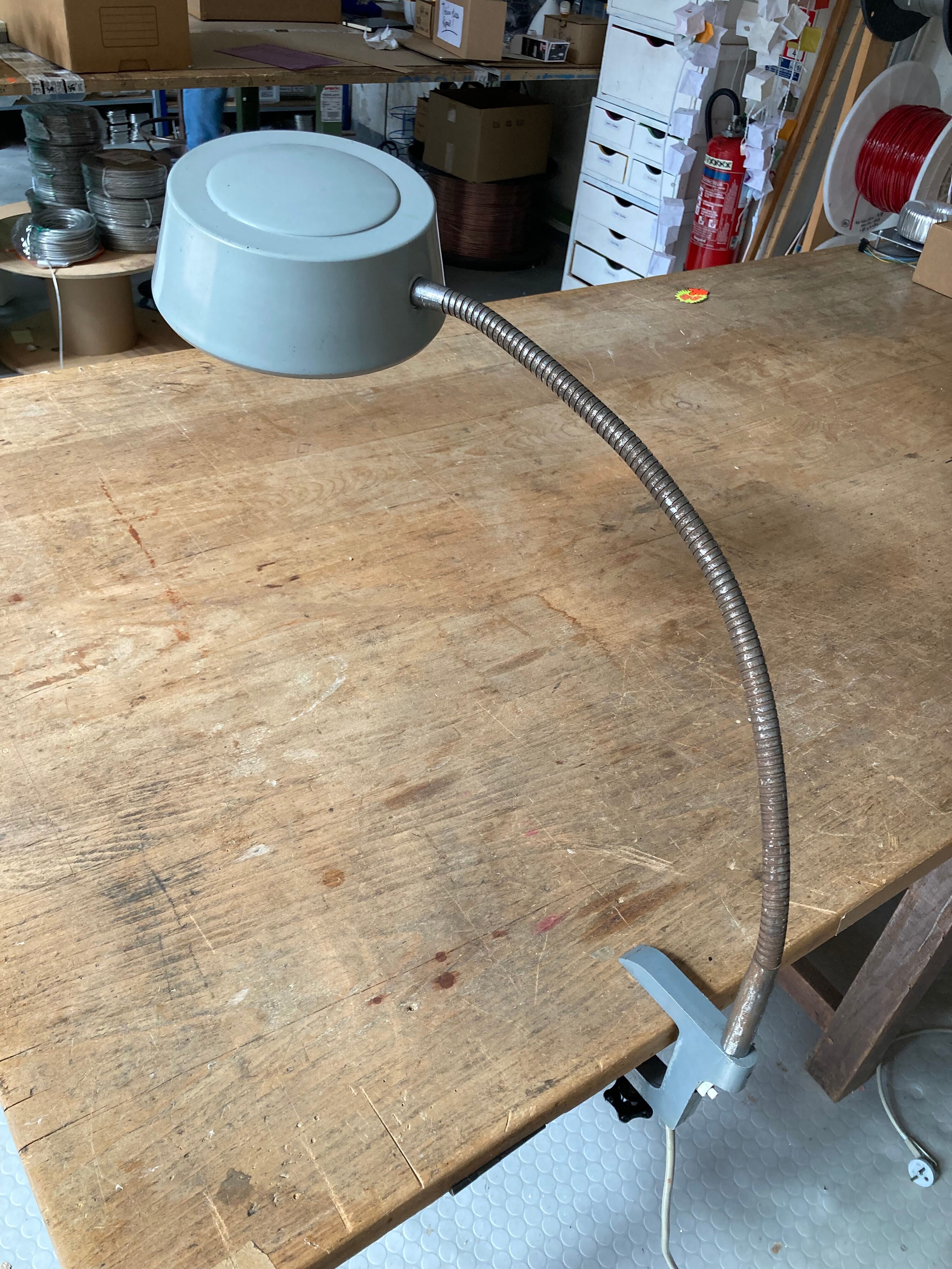 Workshop lamp on ringed metal hose