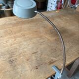 Workshop lamp on ringed metal hose