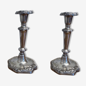 A pair of silver metal candlesticks