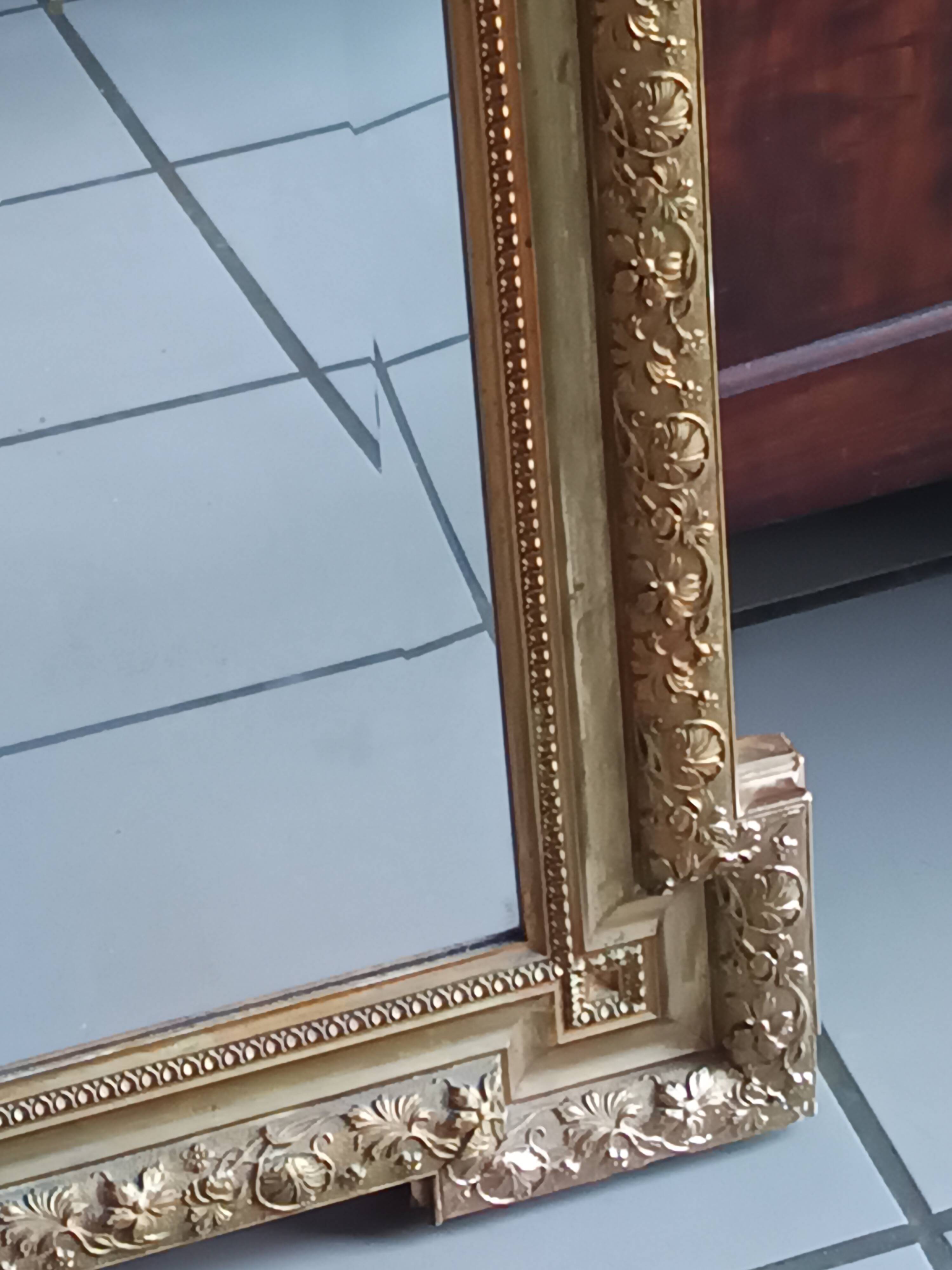 Antique mirror in wood and gilded stucco, neo Louis XVI style.
